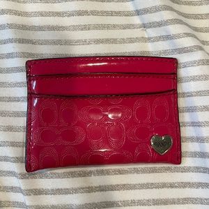 Hot pink plastic Coach wallet